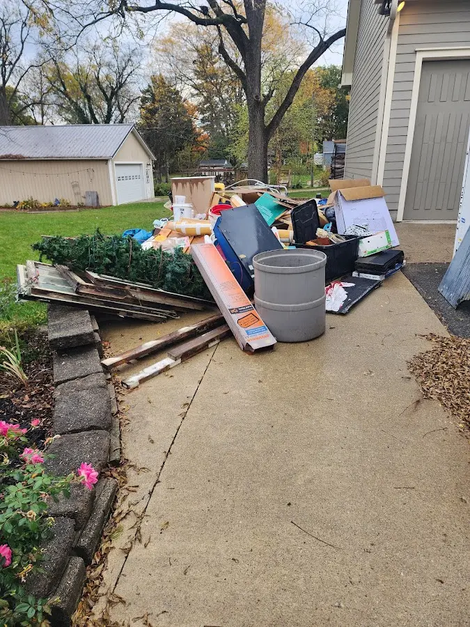 Dumpster being loaded with debris for Residential Dumpster Rental in Acushnet